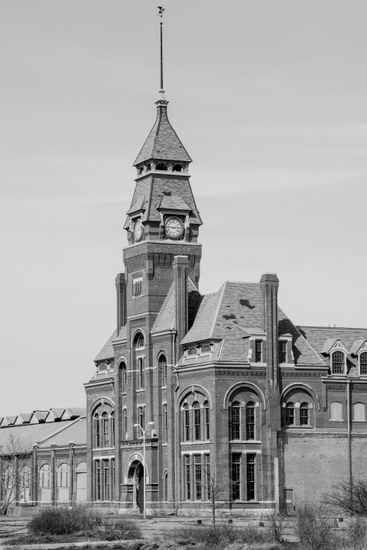 FIG. 1: The Pullman Clock Tower and Administration Building will serve as the visitor center for the Pullman National Monument, recognizing the first planned industrial community in the United States. Along with the Pullman factory, which produced railroad cars, the model town housed a diverse community—more than half of residents were foreign-born—with a population of over 8,000 at its peak in the mid-1880s. The 1894 Pullman Strike was a historic turning point in US labor law. When Pullman workers went on strike after a reduction in wages, other members of the American Railroad Union supported their cause by refusing to add or remove Pullman cars from trains, thereby disrupting rail service across the country and prompting the first-ever federal injunction to block a strike. Image courtesy of Marc PoKempner.