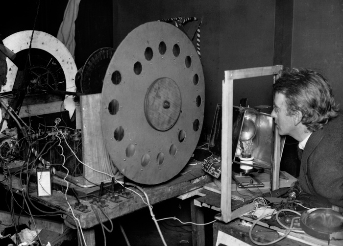 John Logie Baird with his “televisor,” circa 1926. © Hulton-Deutsch Collection/ Corbis Historical via Getty Images.