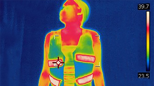 thermal image of a user wearing the earth fabric heated vest